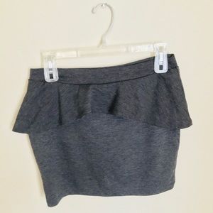 Grey peplum mini skirt.